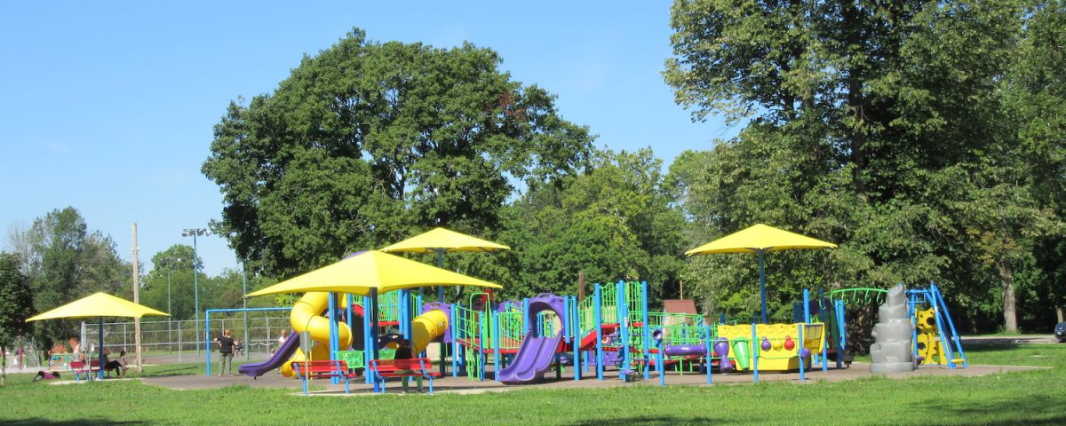 Panoramic view of Snyder Park in Springfield, Ohio showing mature trees, green lawns, and walking paths